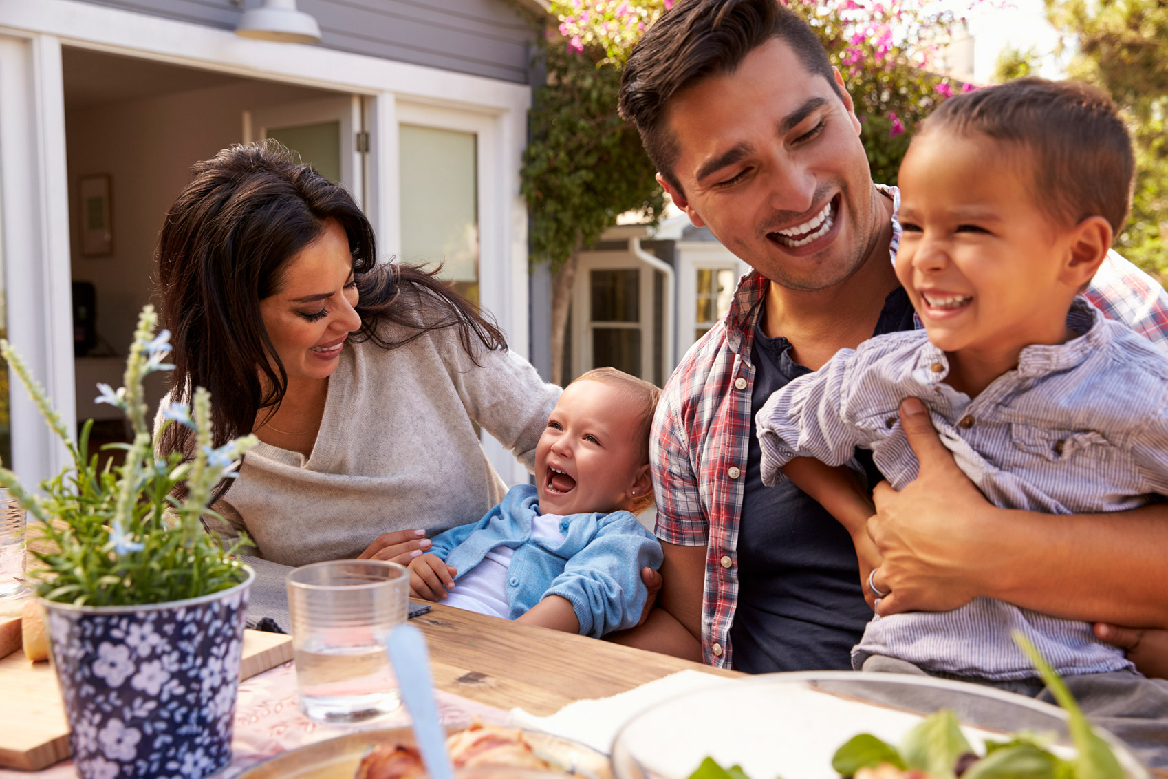 family-at-outside-dining-table_web