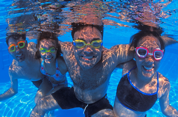 Family group in swimming pool