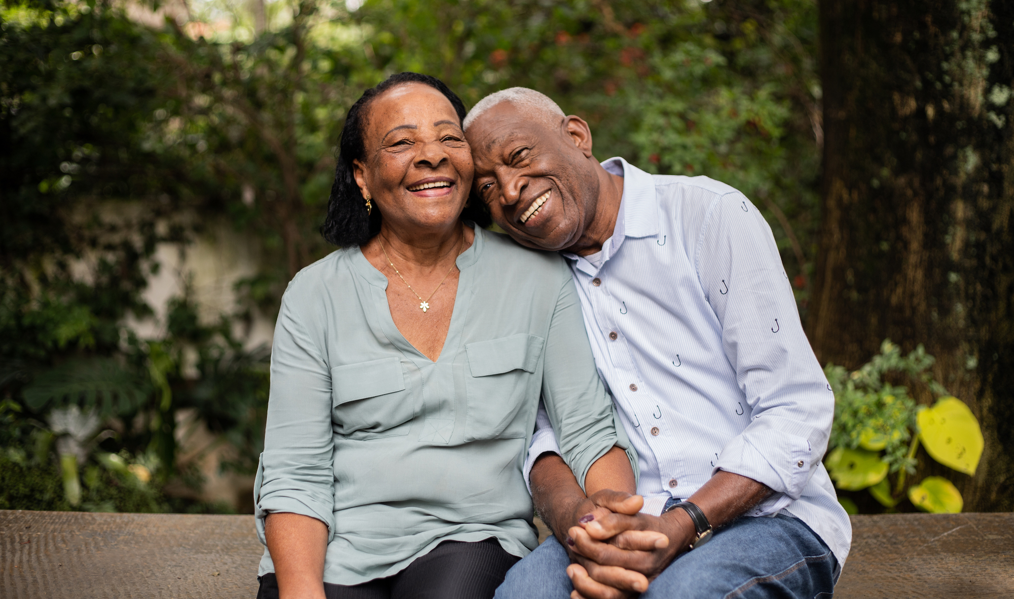Combining Annuities and Life Insurance for Retirement Portrait of a happy senior couple sitting together outdoors
