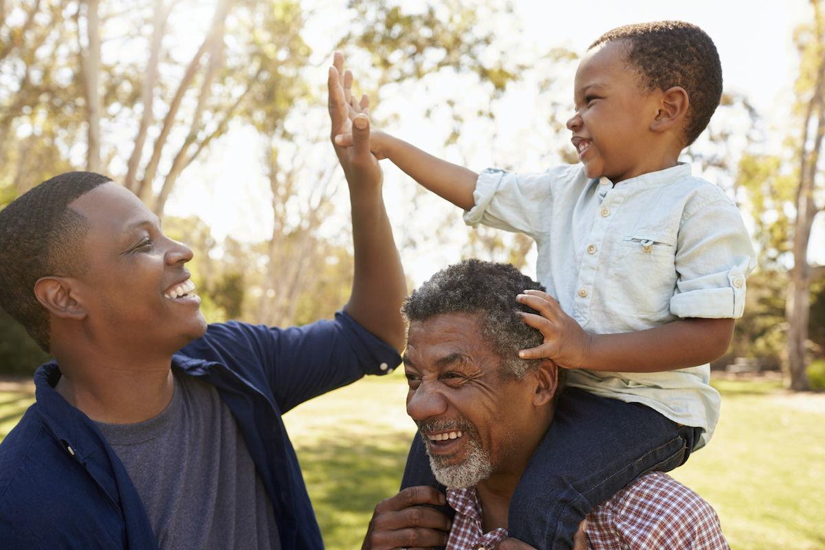 Grandfather With Son And Grandson Having Fun In Park Grandfather With Son And Grandson Having Fun In Park